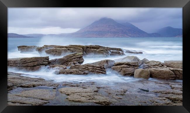 Waves breaking on rocks at Elgol on the Isle of Sk Framed Print by John Frid
