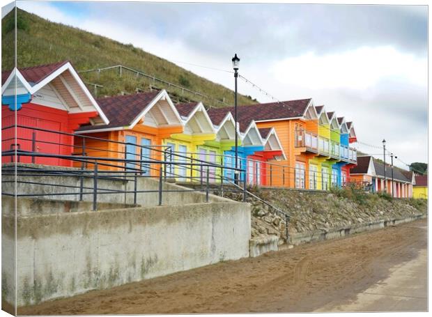 Beach huts in Scarborough Canvas Print by Roy Hinchliffe