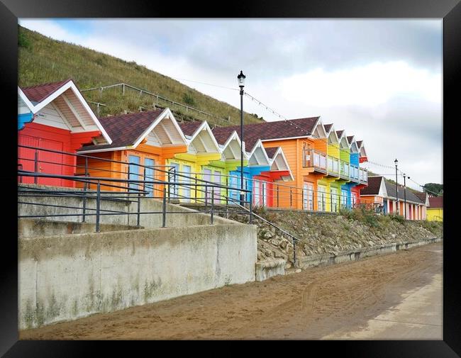 Beach huts in Scarborough Framed Print by Roy Hinchliffe
