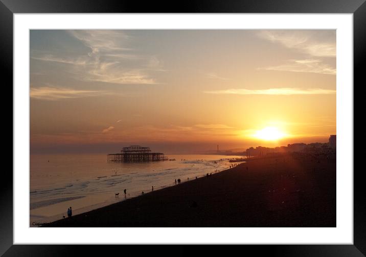 Setting sun and West Pier at Brighton, Sussex, UK. Framed Mounted Print by Peter Bolton