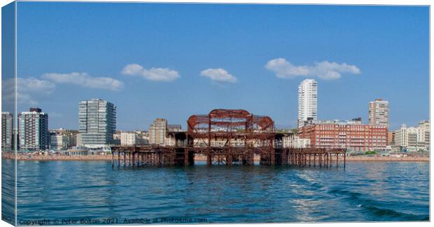 Ruins of West Pier from the sea at Brighton, Sussex, UK. Canvas Print by Peter Bolton