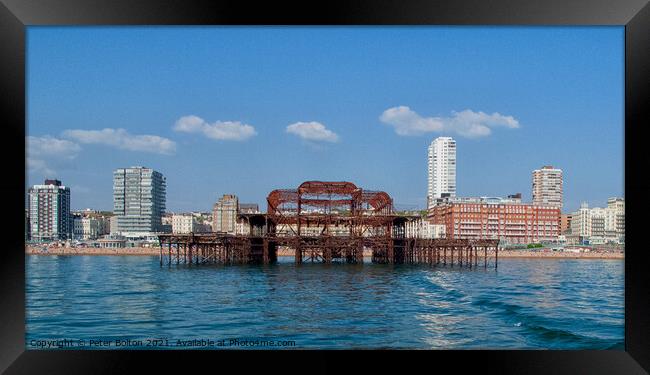 Ruins of West Pier from the sea at Brighton, Sussex, UK. Framed Print by Peter Bolton
