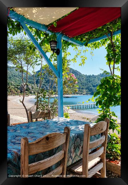 Taverna shaded by vines overlooking the sea Framed Print by Stuart Chard