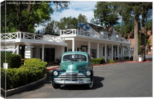 Classic Chevrolet outside vintage motel Canvas Print by Adrian Beese