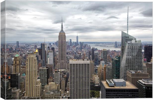 Manhattan and the Empire State Building Canvas Print by Jon Jones