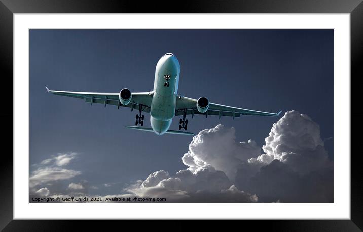 Aircraft flying over bright cumulonimbus cloud.  Framed Mounted Print by Geoff Childs