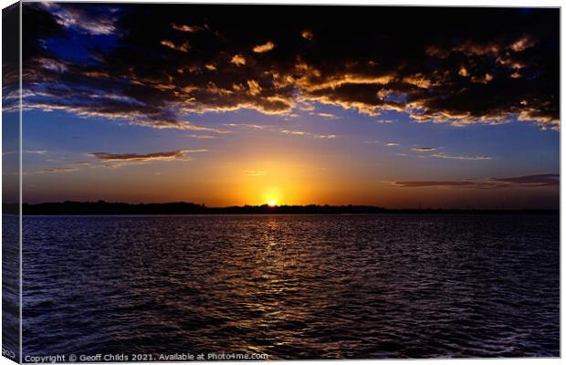 Dramatic gold and blue sunset seascape. Canvas Print by Geoff Childs