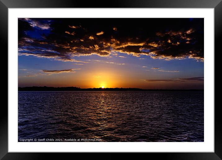 Dramatic gold and blue sunset seascape. Framed Mounted Print by Geoff Childs