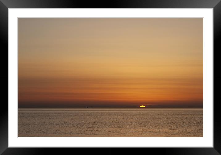 Sun setting at Hunstanton, Norfolk Framed Mounted Print by Dave Turner
