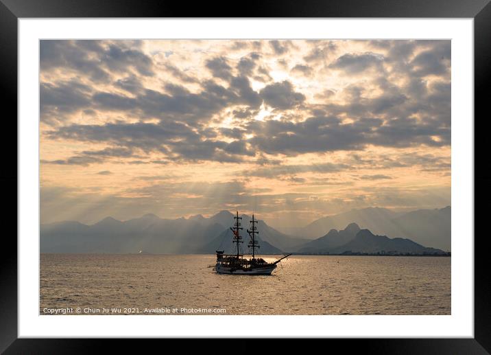 A ship sailing on the sea under the sunset heaven light Framed Mounted Print by Chun Ju Wu