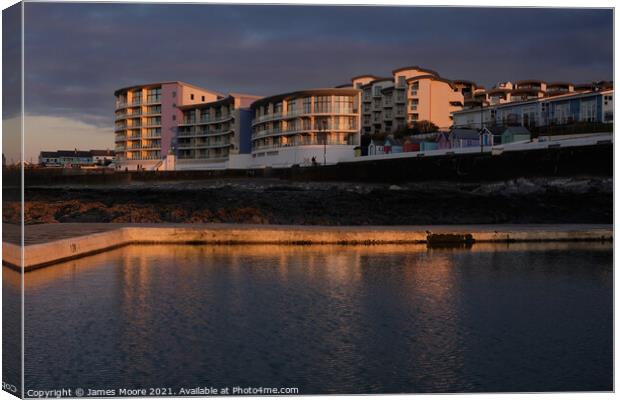 Westward Ho! seaside apartments at sunset Canvas Print by James Moore