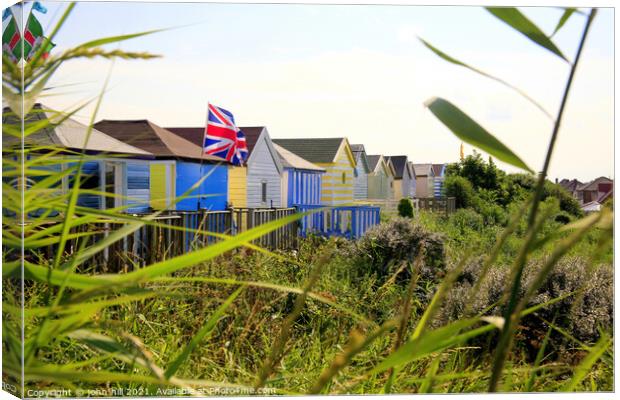 Beach huts at Chapel Point in Chapel St. Leonards. Canvas Print by john hill
