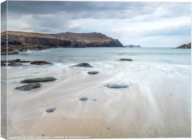 Receding water on Clogher Strand Canvas Print by JUDI LION