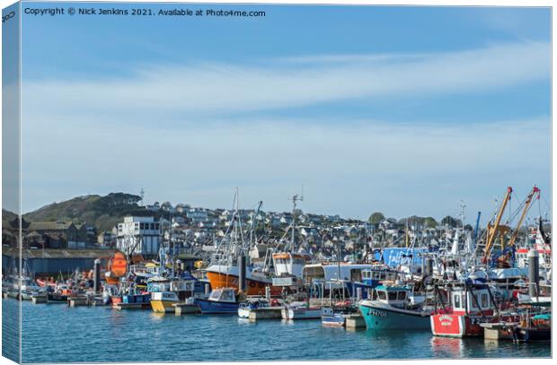 A busy Newlyn Harbour near Penzance Cornwall  Canvas Print by Nick Jenkins