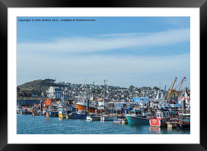 A busy Newlyn Harbour near Penzance Cornwall  Framed Mounted Print by Nick Jenkins