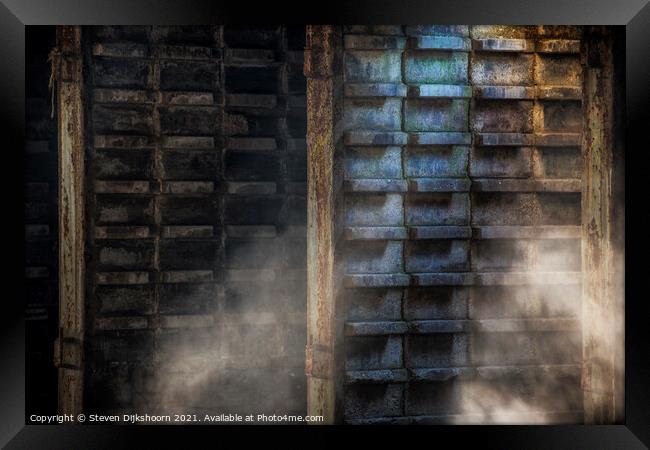 Natural light and dust flies through the air at a concrete factory Framed Print by Steven Dijkshoorn