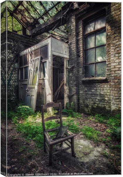 A lonely chair in an abandoned factory in Belgium Canvas Print by Steven Dijkshoorn