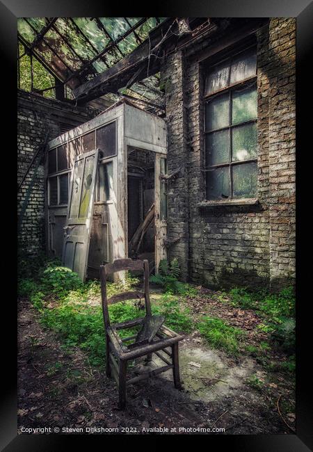 A lonely chair in an abandoned factory in Belgium Framed Print by Steven Dijkshoorn