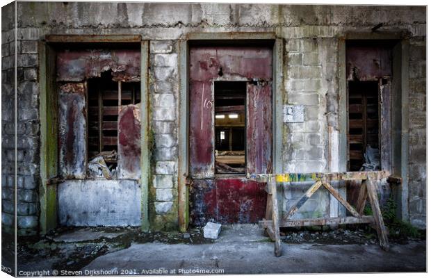 The three red doors in an abandoned factory Canvas Print by Steven Dijkshoorn
