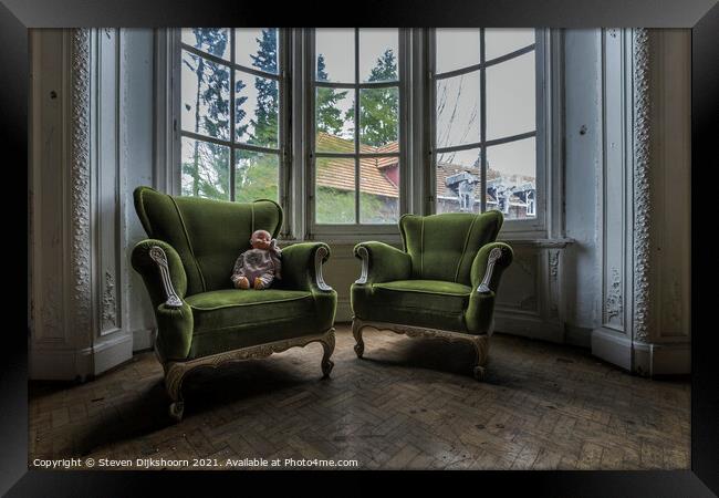 Old green chairs with an doll on it Framed Print by Steven Dijkshoorn