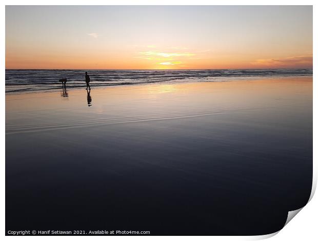Silhouetted couple enjoys sunset at beach 3 Print by Hanif Setiawan