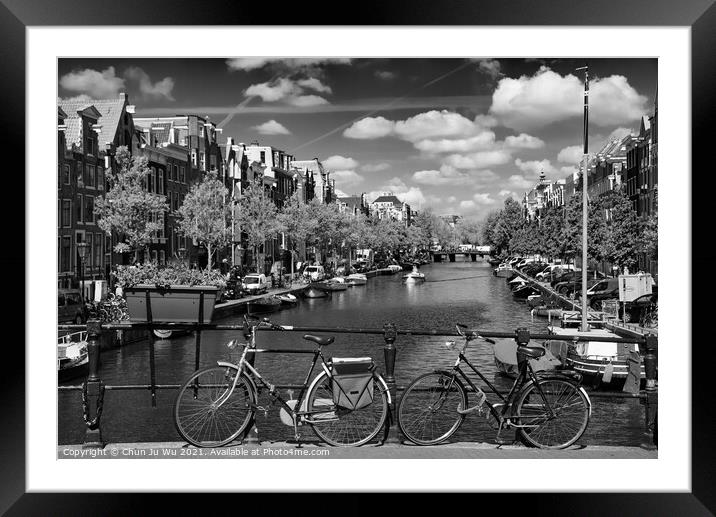 Bikes on the bridge that crosses the canal in Amsterdam (black & white) Framed Mounted Print by Chun Ju Wu