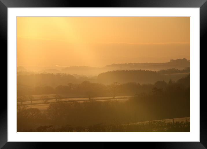 Sky sun rays across the valley Framed Mounted Print by Dave Bell