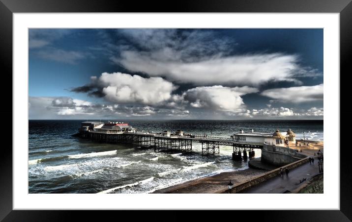 Cromer Pier with sun and clouds Framed Mounted Print by mark humpage