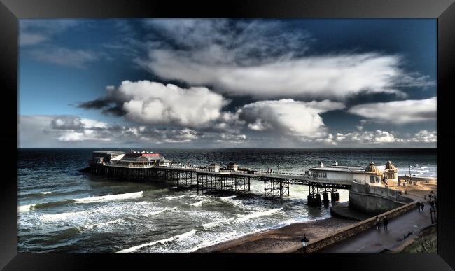 Cromer Pier with sun and clouds Framed Print by mark humpage