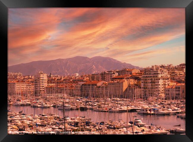 Red sky in Marseille harbor cityscape Framed Print by Ann Biddlecombe