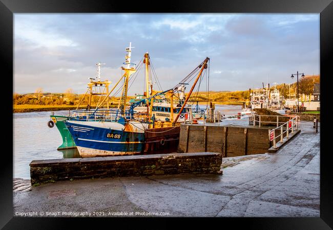 Fishing trawlers moored at Kirkcudbright harbour on the River Dee at sunset Framed Print by SnapT Photography