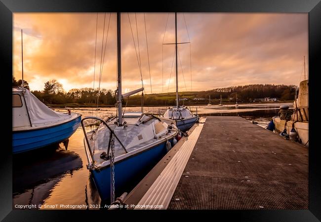 Yachts moored at Kirkcudbright marina at sunset in winter on the Dee estuary Framed Print by SnapT Photography