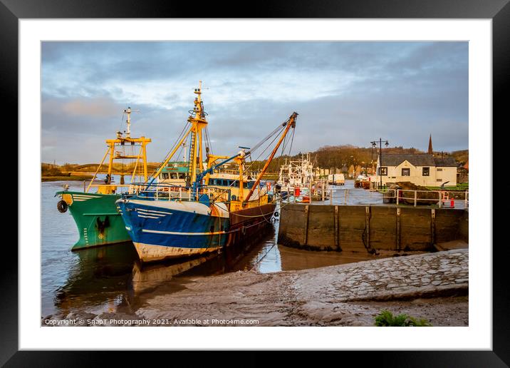 Fishing trawlers moored at Kirkcudbright harbour on the River Dee at sunset Framed Mounted Print by SnapT Photography