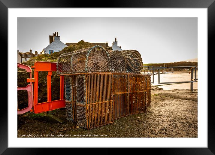 Lobster and prawn fishing pots and creels stacked up at Kirkcudbright Harbour Framed Mounted Print by SnapT Photography