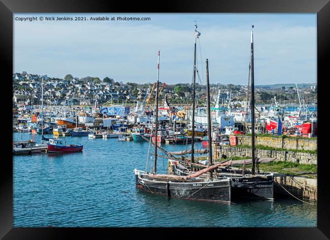 Newlyn Harbour with boats of all shapes and sizes  Framed Print by Nick Jenkins