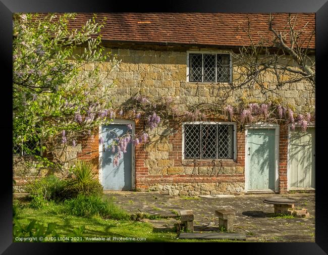 Stone Cottage and Wisteria Framed Print by JUDI LION