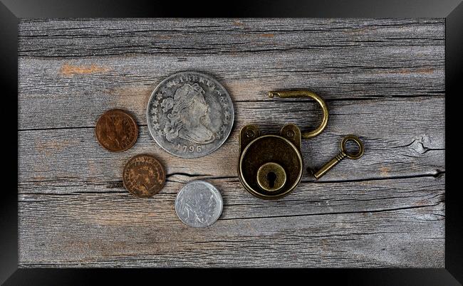 Close up of open antique coins and lock on weather Framed Print by Thomas Baker