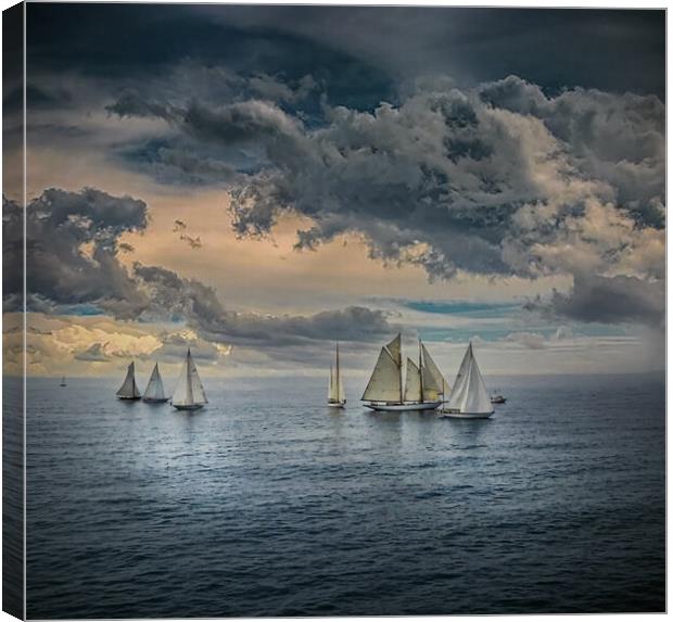 Yachts sailing in calm seas with dramatic skies in Canvas Print by Dave Williams