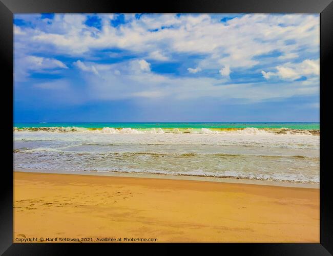 Sand beach wavy sea and cloud sky 1b Framed Print by Hanif Setiawan