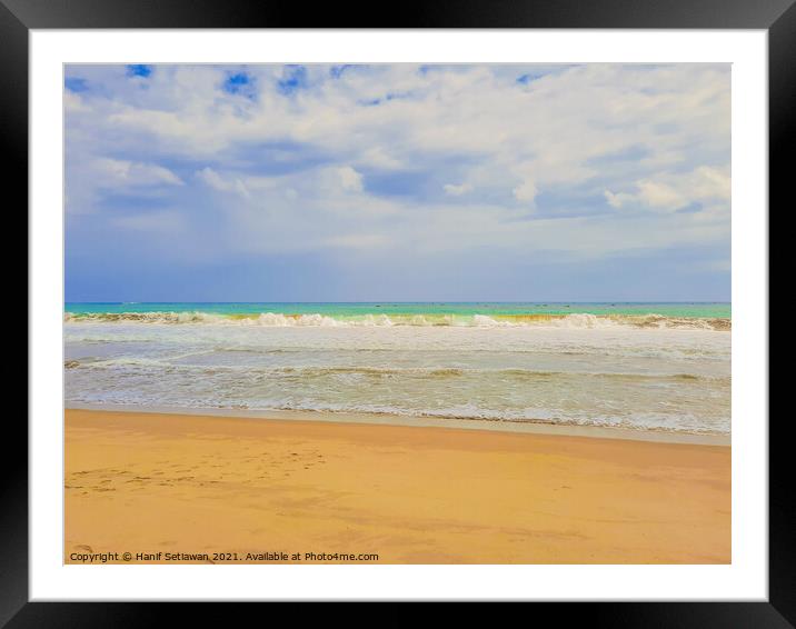 Sand beach wavy sea and cloud sky 1d Framed Mounted Print by Hanif Setiawan
