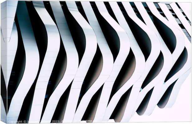 Modern architecture of a building with curves and straight lines Canvas Print by Joaquin Corbalan
