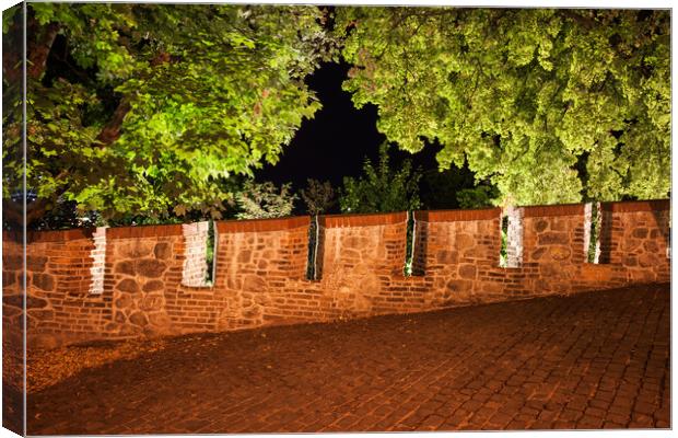 Castle Wall Battlement and Trees at Night Canvas Print by Artur Bogacki