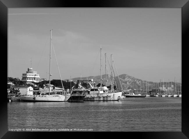 black and white old boats in need of Love Framed Print by Ann Biddlecombe