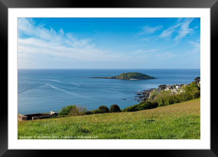 Lone fishing boat heading out to sea at Looe on a bright sunny morning Framed Mounted Print by Jim Peters