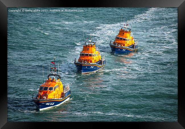 Brave Lifeboat Crew Battling Rough Seas Framed Print by kathy white