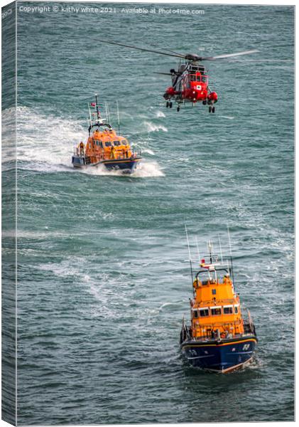Lifeboats with the rescue helicopter on stormy sea Canvas Print by kathy white