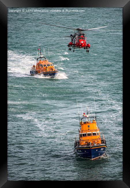 Lifeboats with the rescue helicopter on stormy sea Framed Print by kathy white