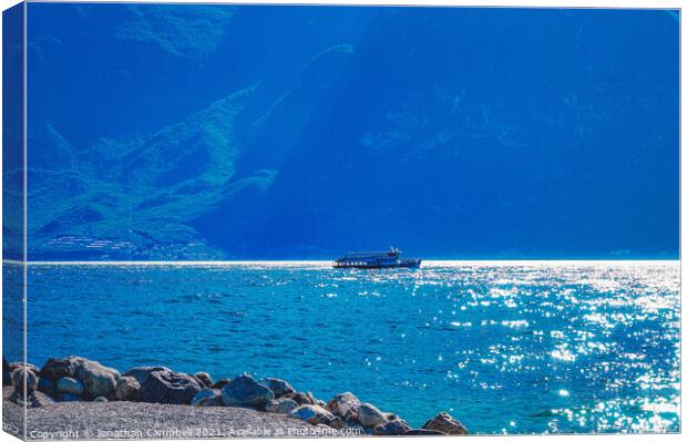 Limone Sul Garda - Lake view with boat Canvas Print by Jonathan Campbell