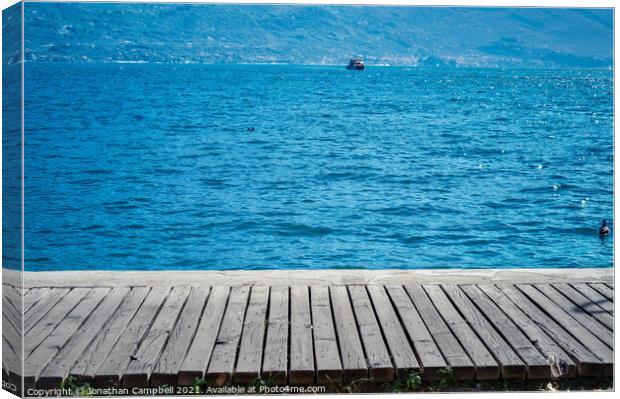 Limone Sul Garda - Lake view and pier Canvas Print by Jonathan Campbell