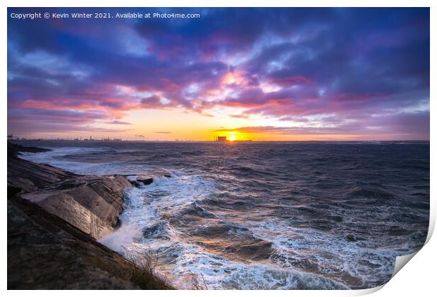 The Sun setting over a stormy South Gare Print by Kevin Winter